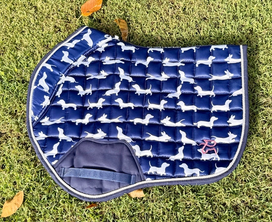 The Snag navy dachshund-print jump saddle pad, flat lay