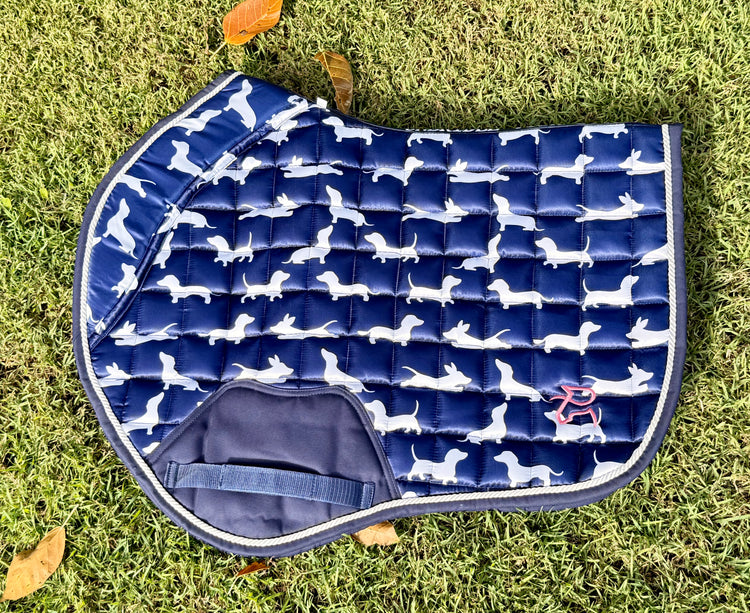 The Snag navy dachshund-print jump saddle pad, flat lay