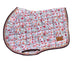 Blush floral jump saddle pad with brown trim on bench