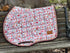 Blush floral jump saddle pad on white background